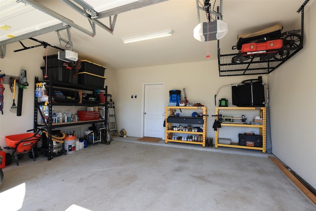 15623 Lavender Bay Ln, Cypress, TX 77429 - garage with a garage door opener and a workshop area