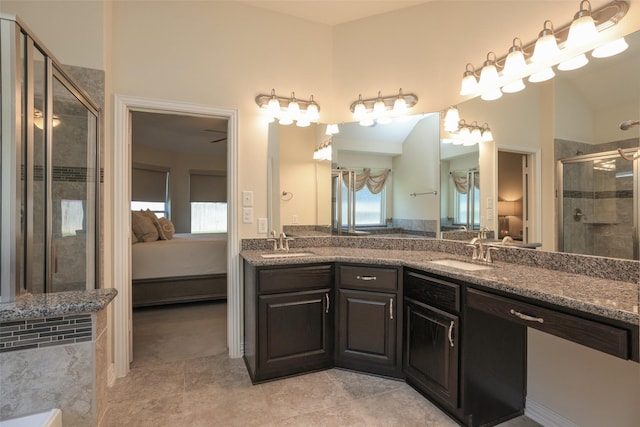 15623 Lavender Bay Ln, Cypress, TX 77429 - ensuite bathroom featuring a stall shower, double vanity, and tile patterned flooring