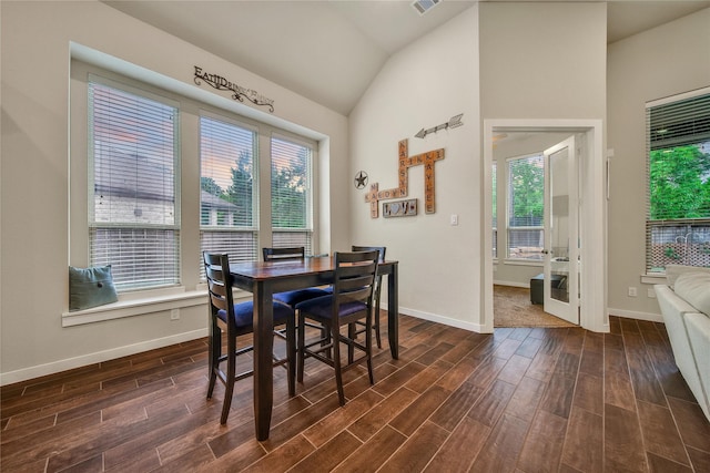 16711 Ramsay Cascades Dr, Humble, TX 77346 - dining room with vaulted ceiling, dark wood-style floors, and baseboards