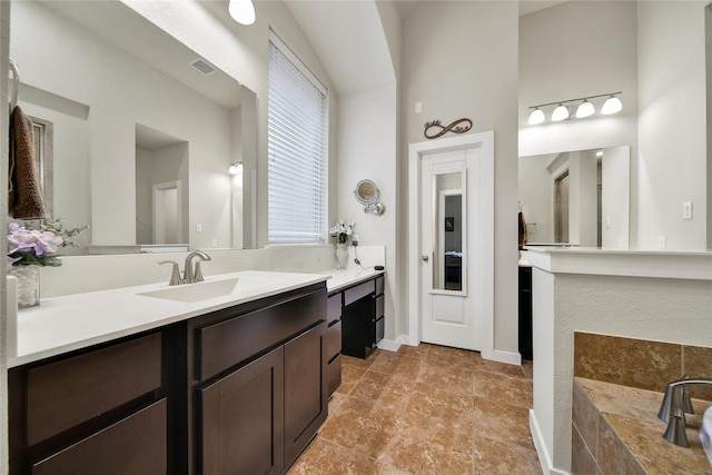 16711 Ramsay Cascades Dr, Humble, TX 77346 - full bath featuring vanity, a tub to relax in, baseboards, and a high ceiling
