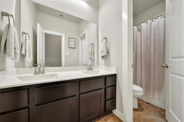 16711 Ramsay Cascades Dr, Humble, TX 77346 - bathroom with toilet, double vanity, and curtained shower