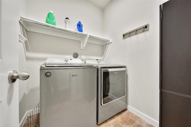 16711 Ramsay Cascades Dr, Humble, TX 77346 - washroom featuring washer and dryer, baseboards, and light tile patterned floors