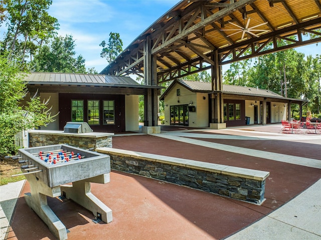 16711 Ramsay Cascades Dr, Humble, TX 77346 - view of patio / terrace with an outdoor kitchen, french doors, a ceiling fan, and a gazebo
