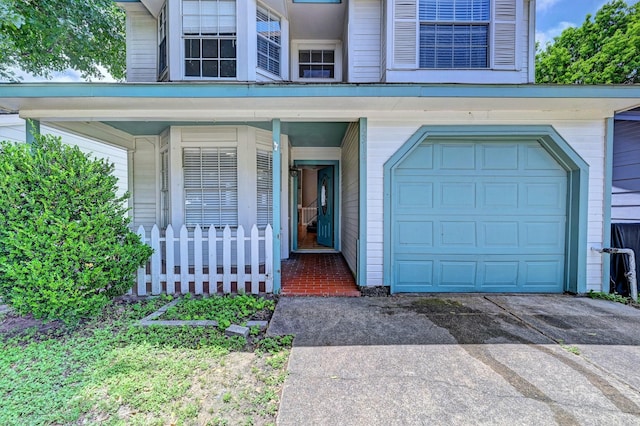 4319 Conward Dr, Houston, TX 77066 - view of exterior entry featuring a garage, asphalt driveway, and covered porch