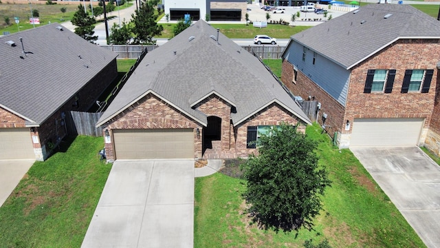 4827 San Gregorio Ln, Katy, TX 77493 - view of front of home with brick siding, driveway, and a shingled roof