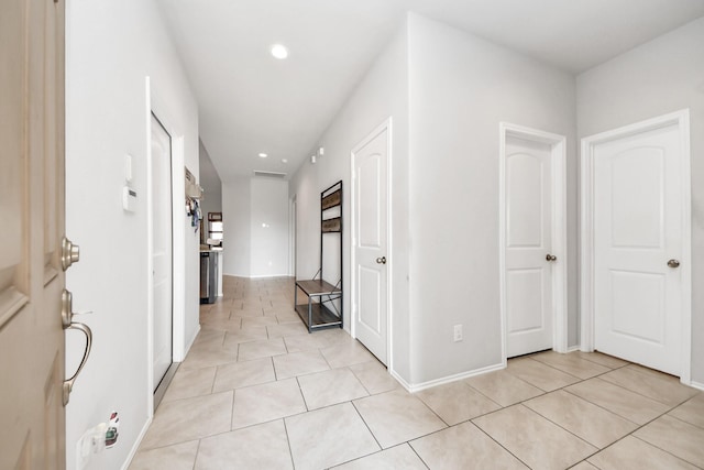 4827 San Gregorio Ln, Katy, TX 77493 - hallway with light tile patterned flooring, recessed lighting, and baseboards