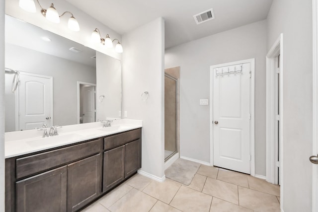 4827 San Gregorio Ln, Katy, TX 77493 - full bath featuring a shower stall, double vanity, tile patterned floors, and baseboards