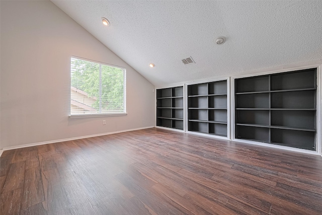 10315 Sun City Ct, Houston, TX 77099 - unfurnished room with a textured ceiling, lofted ceiling, wood finished floors, and baseboards