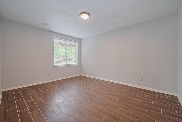 10315 Sun City Ct, Houston, TX 77099 - spare room with dark wood finished floors and baseboards