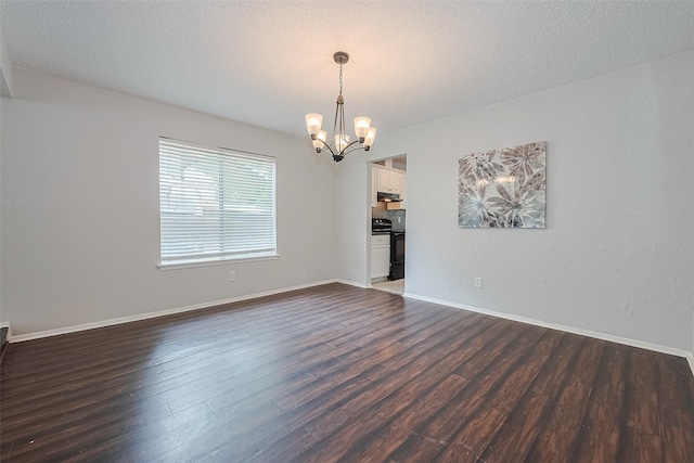 10315 Sun City Ct, Houston, TX 77099 - unfurnished room with a chandelier, dark wood-style floors, a textured ceiling, and baseboards