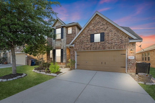8315 Egret Bay Cir, Baytown, TX 77523 - view of front facade featuring driveway, brick siding, a garage, and a front lawn