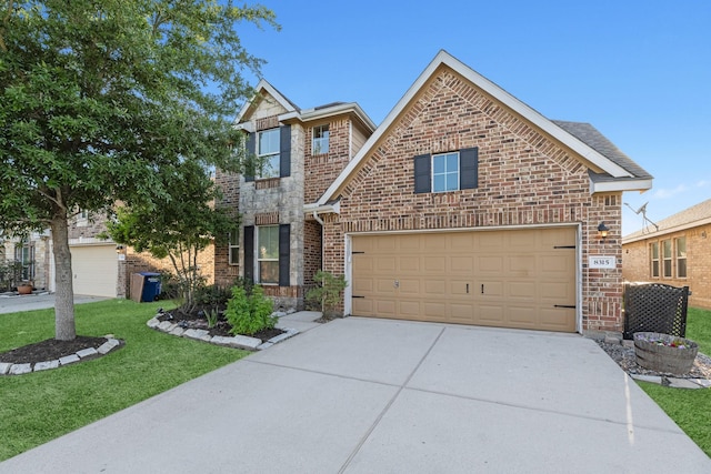 8315 Egret Bay Cir, Baytown, TX 77523 - traditional-style house featuring brick siding, concrete driveway, a garage, and a front lawn