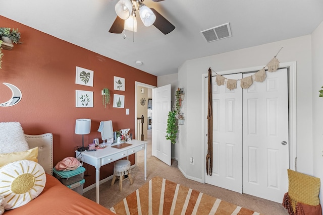 8315 Egret Bay Cir, Baytown, TX 77523 - bedroom with light carpet, a ceiling fan, a closet, baseboards, and a desk