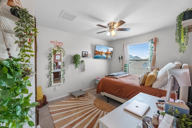 8315 Egret Bay Cir, Baytown, TX 77523 - carpeted bedroom with baseboards and ceiling fan