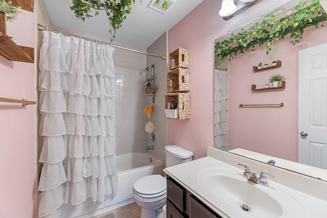 8315 Egret Bay Cir, Baytown, TX 77523 - bathroom featuring toilet, vanity, shower / tub combo with curtain, and tile patterned flooring