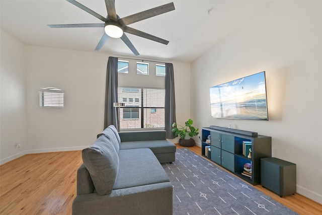 8715 Meadowcroft Dr Unit 1002, Houston, TX 77063 - living area featuring wood finished floors, plenty of natural light, ceiling fan, and baseboards