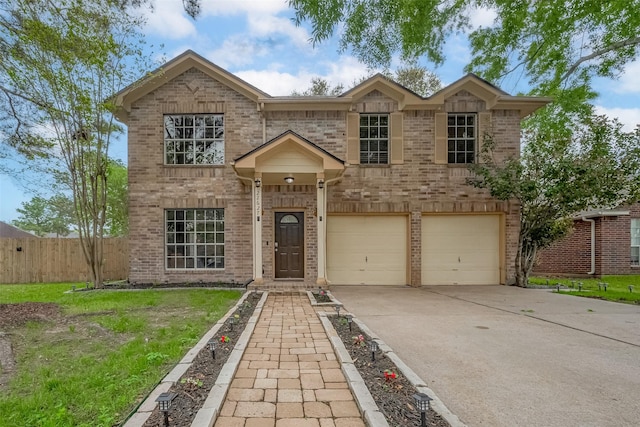 22627 Williamschase Dr, Katy, TX 77449 - traditional-style house with an attached garage, driveway, and brick siding