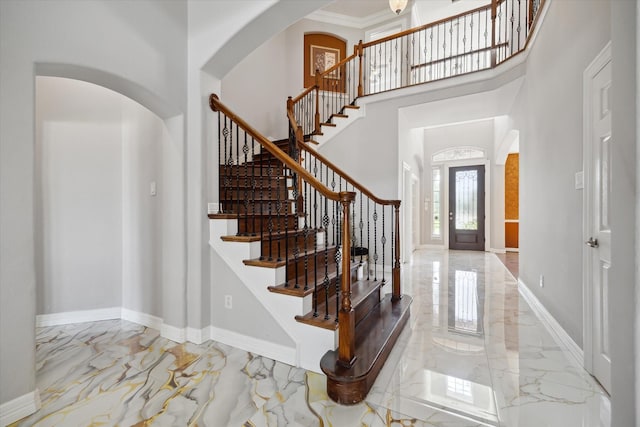 11127 Salento Ct, Richmond, TX 77406 - foyer entrance with marble tiled flooring, arched walkways, stairs, and a high ceiling