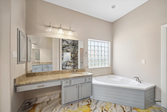 11127 Salento Ct, Richmond, TX 77406 - bathroom with a garden tub, vanity, and marble finish flooring
