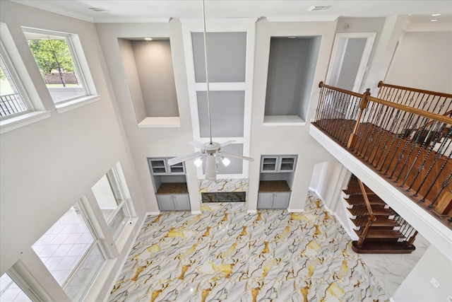 11127 Salento Ct, Richmond, TX 77406 - foyer featuring a ceiling fan, marble finish floors, crown molding, and baseboards