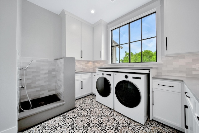 18829 Cypress Church Rd, Cypress, TX 77433 - clothes washing area with washing machine and clothes dryer, cabinet space, and recessed lighting