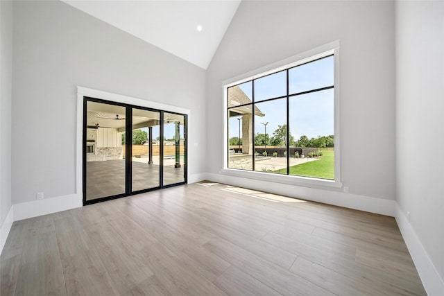 18829 Cypress Church Rd, Cypress, TX 77433 - spare room with high vaulted ceiling, baseboards, and wood finished floors