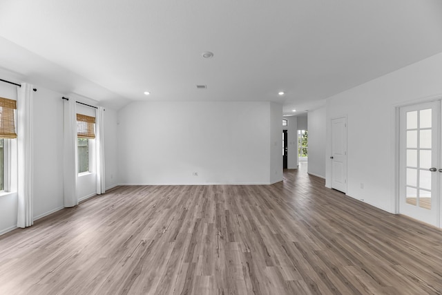 17723 Sapphire Pines Dr, New Caney, TX 77357 - unfurnished living room with light wood finished floors, plenty of natural light, recessed lighting, and baseboards