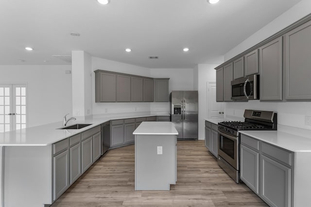 17723 Sapphire Pines Dr, New Caney, TX 77357 - kitchen featuring stainless steel appliances, a sink, a center island, a peninsula, and recessed lighting