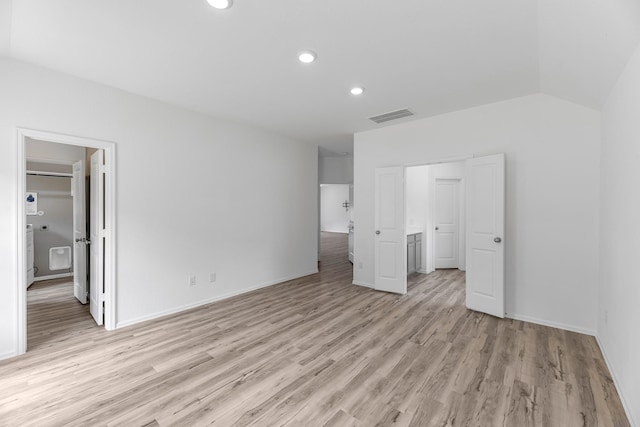 17723 Sapphire Pines Dr, New Caney, TX 77357 - unfurnished bedroom featuring light wood finished floors, recessed lighting, baseboards, and vaulted ceiling