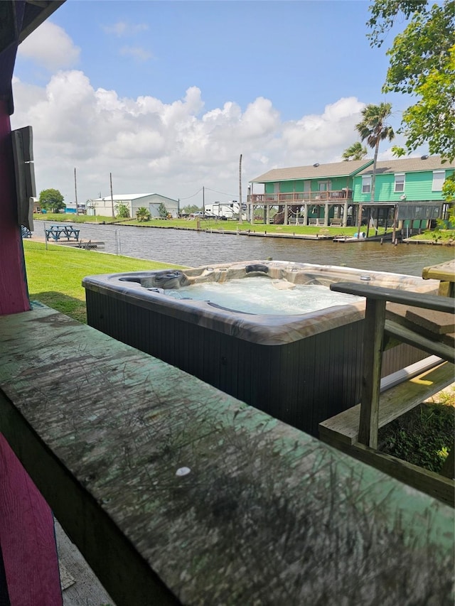 14545 Mariner St, Sargent, TX 77414 - view of pool with a hot tub and a water view