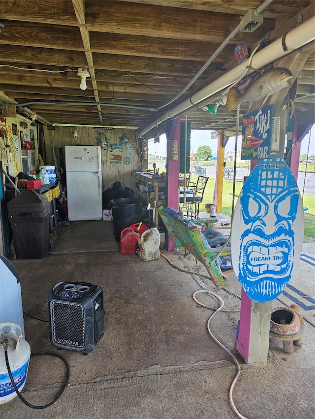 14545 Mariner St, Sargent, TX 77414 - basement featuring freestanding refrigerator