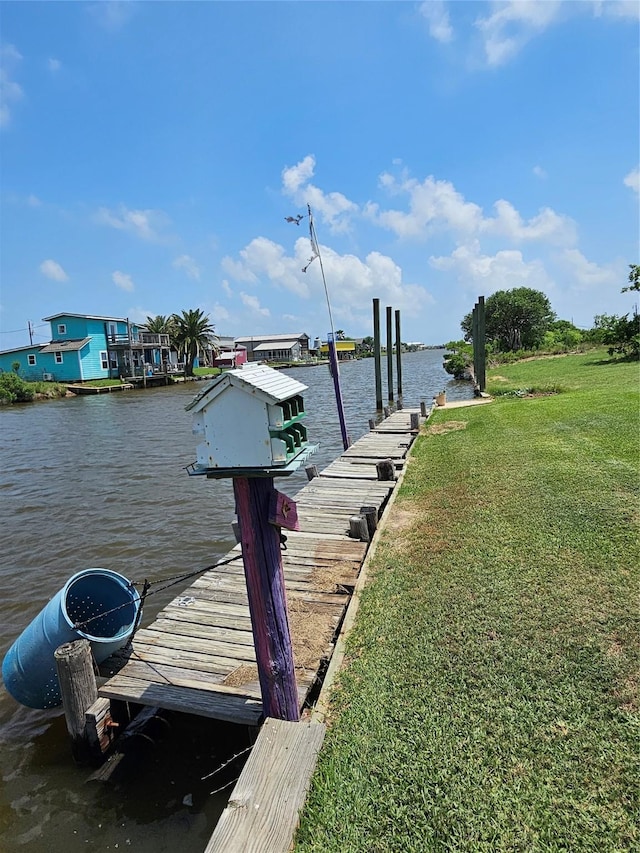 14545 Mariner St, Sargent, TX 77414 - dock featuring a water view and a lawn