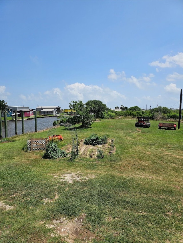 14545 Mariner St, Sargent, TX 77414 - view of green lawn featuring a water view