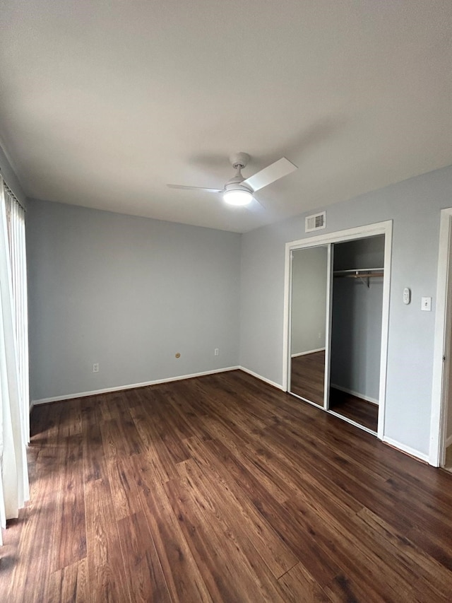8435 Hearth Dr Unit 21, Houston, TX 77054 - unfurnished bedroom with dark wood-style flooring and baseboards