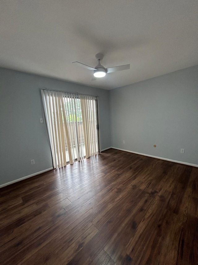 8435 Hearth Dr Unit 21, Houston, TX 77054 - spare room with a ceiling fan, dark wood-style flooring, and baseboards