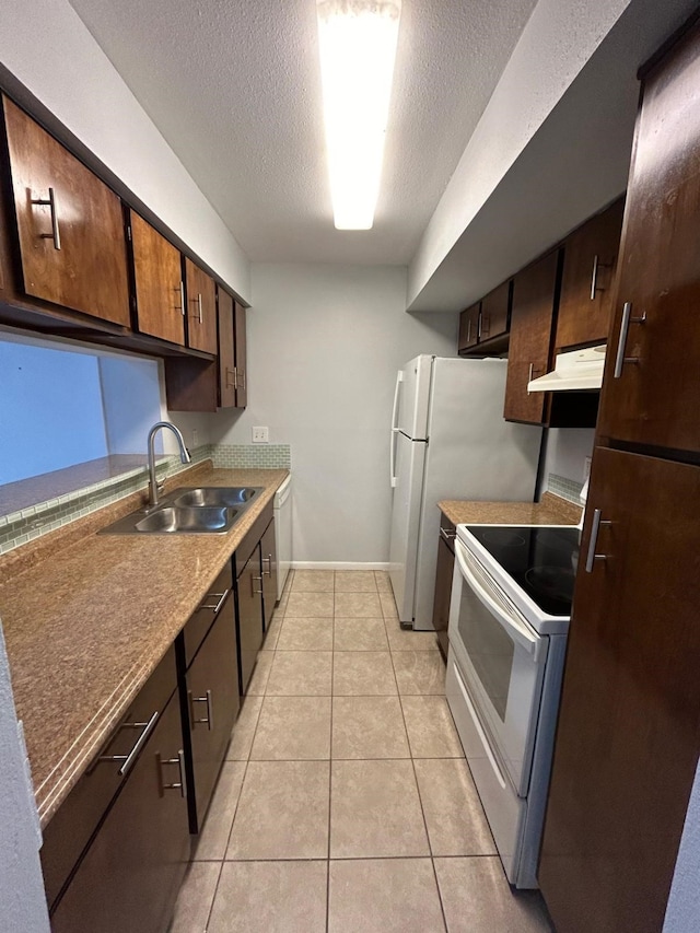 8435 Hearth Dr Unit 21, Houston, TX 77054 - kitchen with white appliances, a sink, a textured ceiling, under cabinet range hood, and light tile patterned floors