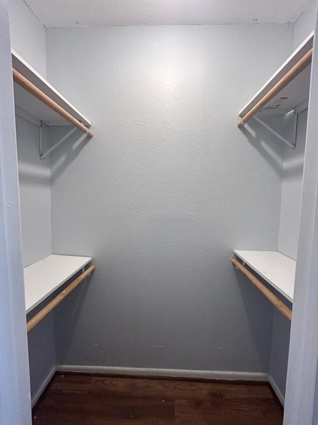 8435 Hearth Dr Unit 21, Houston, TX 77054 - spacious closet with dark wood finished floors and built in desk