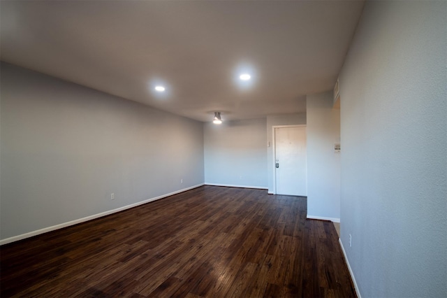 8435 Hearth Dr Unit 21, Houston, TX 77054 - empty room featuring baseboards, dark wood finished floors, and recessed lighting