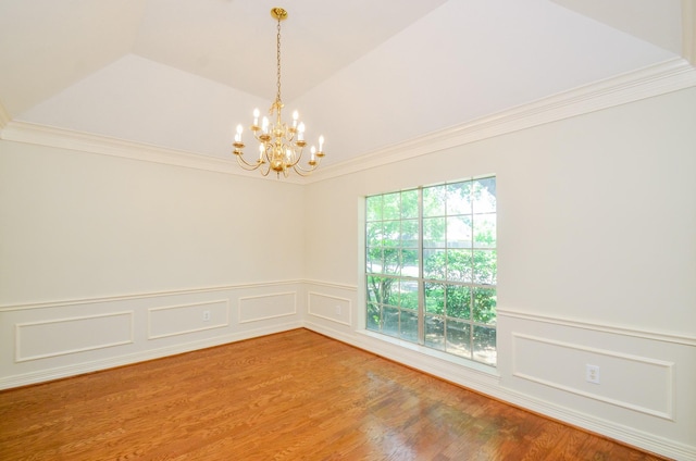 2303 Reflection Ct, Missouri City, TX 77459 - spare room with a chandelier, a wainscoted wall, crown molding, a decorative wall, and wood finished floors
