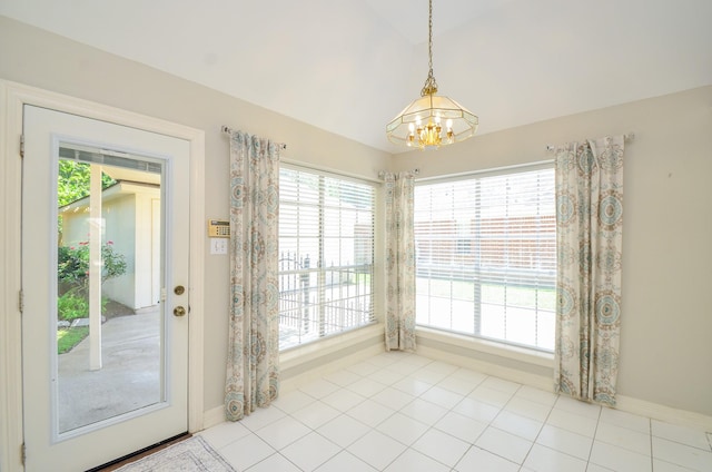 2303 Reflection Ct, Missouri City, TX 77459 - unfurnished dining area featuring a chandelier, lofted ceiling, baseboards, and tile patterned flooring