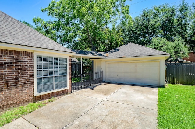 2303 Reflection Ct, Missouri City, TX 77459 - view of front of property featuring fence, a detached garage, brick siding, and a shingled roof