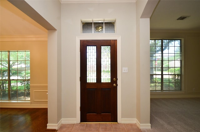 2303 Reflection Ct, Missouri City, TX 77459 - foyer entrance featuring healthy amount of natural light and crown molding