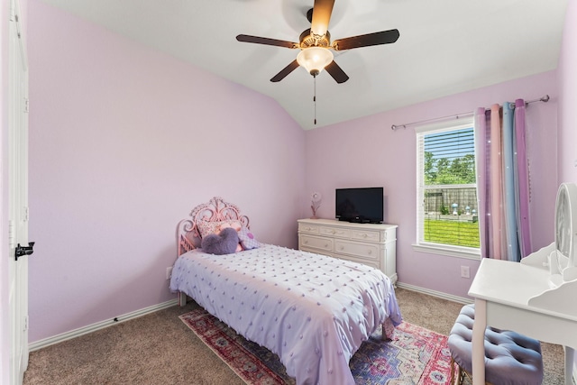 bedroom featuring light colored carpet, lofted ceiling, baseboards, and ceiling fan