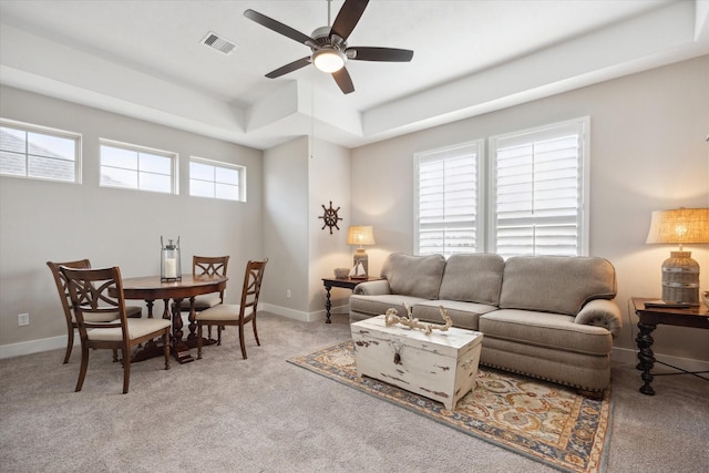 809 Stella Vista Ct, Katy, TX 77493 - living room with a tray ceiling, ceiling fan, light colored carpet, and baseboards