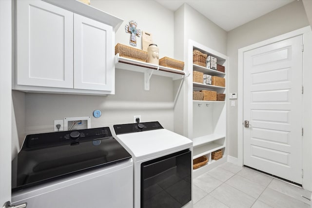 809 Stella Vista Ct, Katy, TX 77493 - clothes washing area with washer and clothes dryer, cabinet space, light tile patterned floors, and baseboards