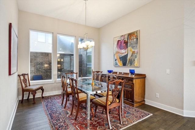 13234 James Terrace Ln, Houston, TX 77059 - dining space featuring dark wood-style floors, a chandelier, and baseboards