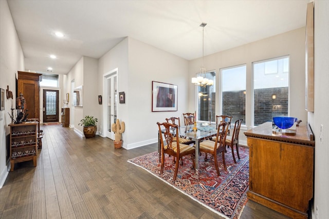 13234 James Terrace Ln, Houston, TX 77059 - dining room featuring healthy amount of natural light, dark wood-type flooring, a chandelier, baseboards, and recessed lighting