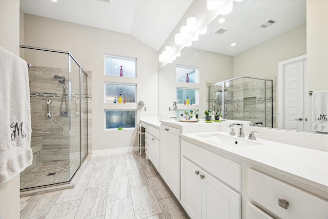 13234 James Terrace Ln, Houston, TX 77059 - full bathroom with a stall shower, lofted ceiling, two vanities, and baseboards