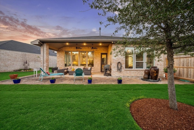 13234 James Terrace Ln, Houston, TX 77059 - back of house featuring an outdoor living space, a ceiling fan, a patio area, and brick siding