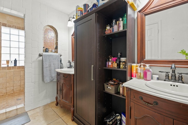 405 Spencer Lndg W, La Porte, TX 77571 - full bath with two vanities, a walk in shower, and tile patterned flooring